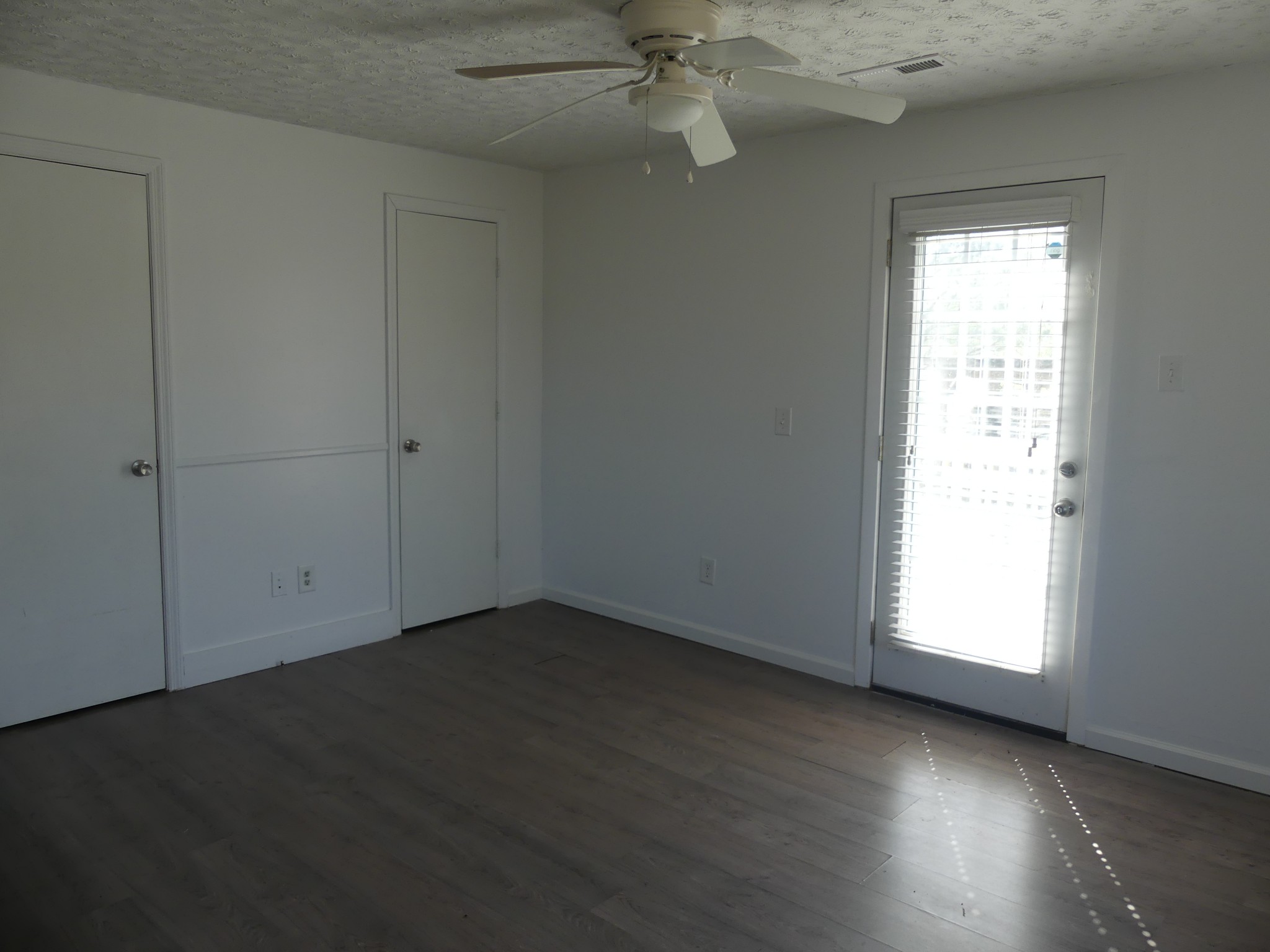 231 Mountain Road Elora, TN 37328 - Photo 18 of 32 an empty room with wooden floor closet and windows