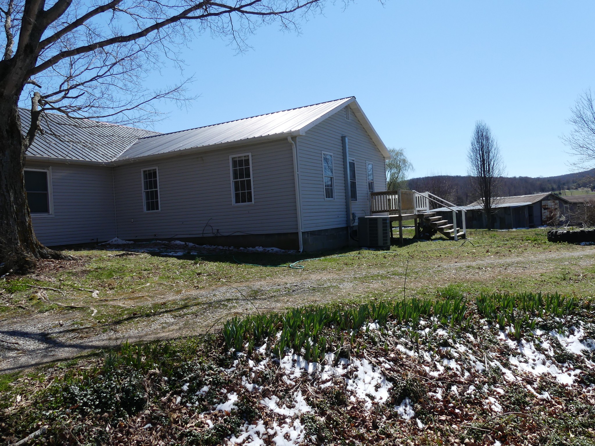 231 Mountain Road Elora, TN 37328 - Photo 2 of 32 a house with trees in front of it