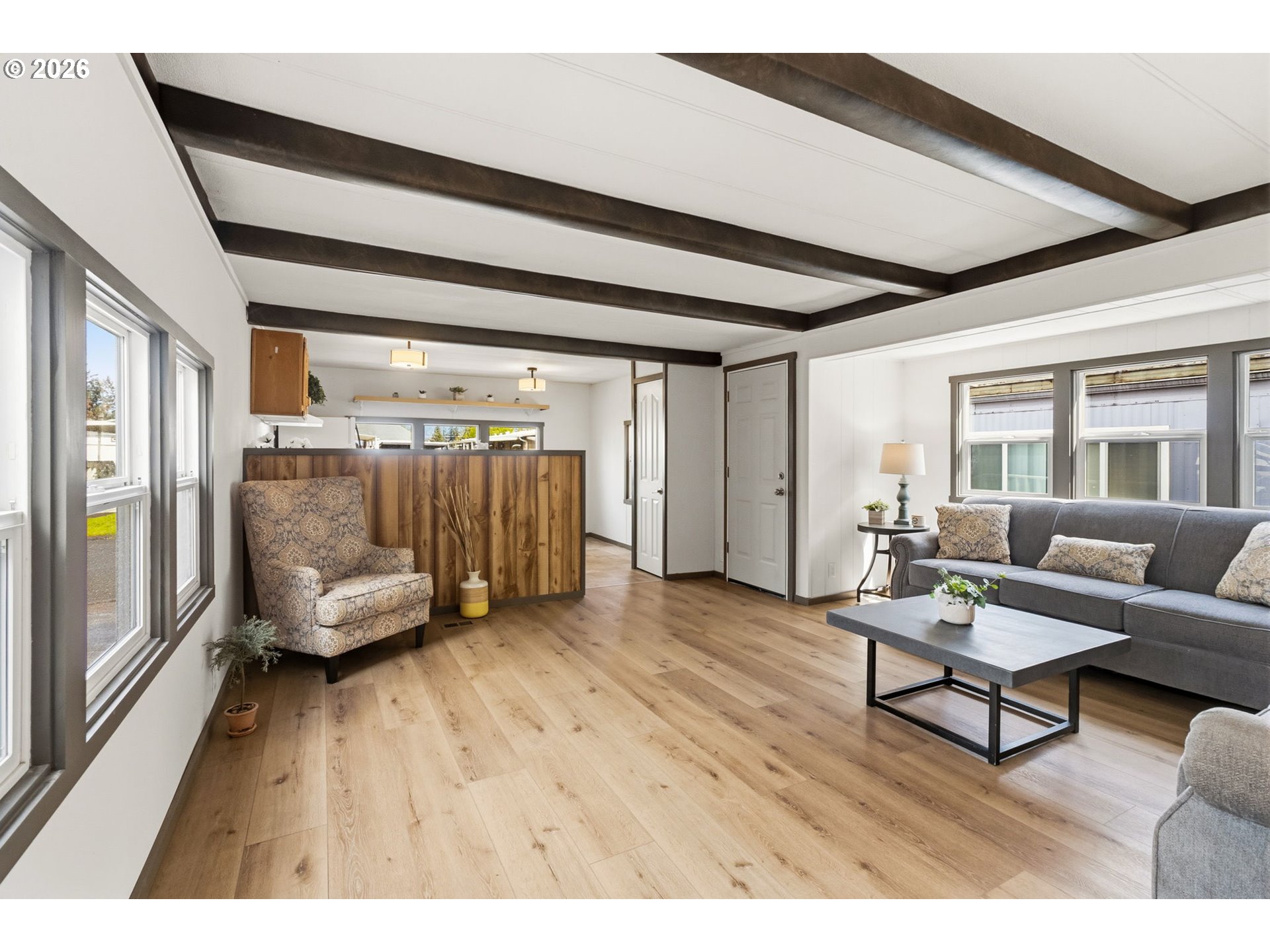 205 South 54th Street, Unit 76 Springfield, OR 97478 - Photo 10 of 41 a living room with furniture and a wooden floor