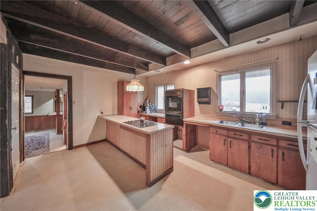 355 Hickory Road Palmerton, PA 18071 - Photo 13 of 66 a large white kitchen with a large window