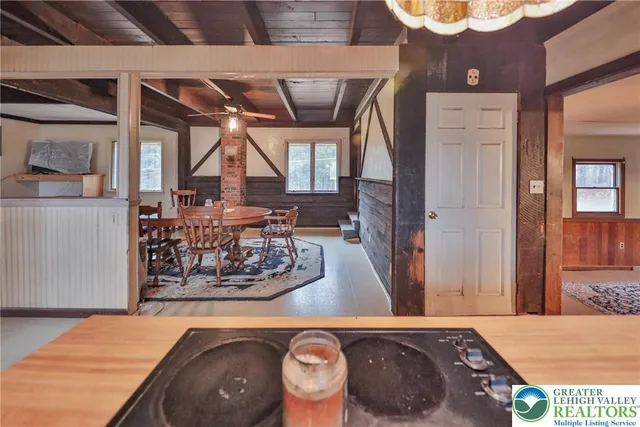 a kitchen with stainless steel appliances granite countertop a sink a stove and cabinets