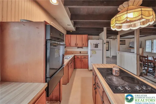a view of a chairs and table in the balcony