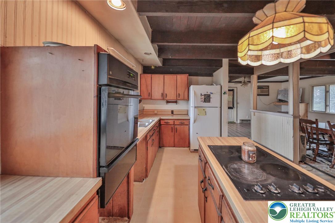 355 Hickory Road Palmerton, PA 18071 - Photo 18 of 66 a kitchen with stainless steel appliances granite countertop a sink a stove and cabinets