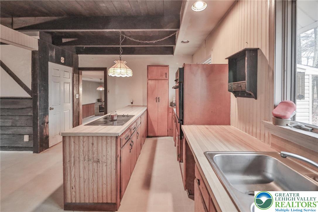 355 Hickory Road Palmerton, PA 18071 - Photo 19 of 66 a kitchen with a sink a stove and a refrigerator