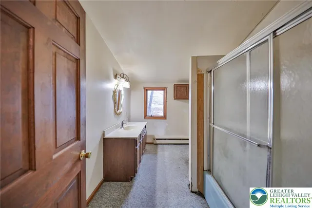 a view of empty room with wooden ceiling