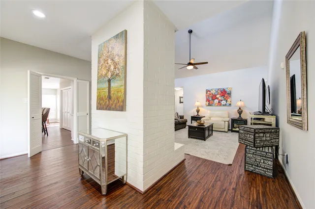 a living room with furniture window and wooden floor