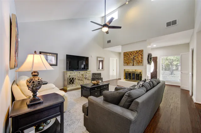 a living room with furniture fireplace and a flat screen tv
