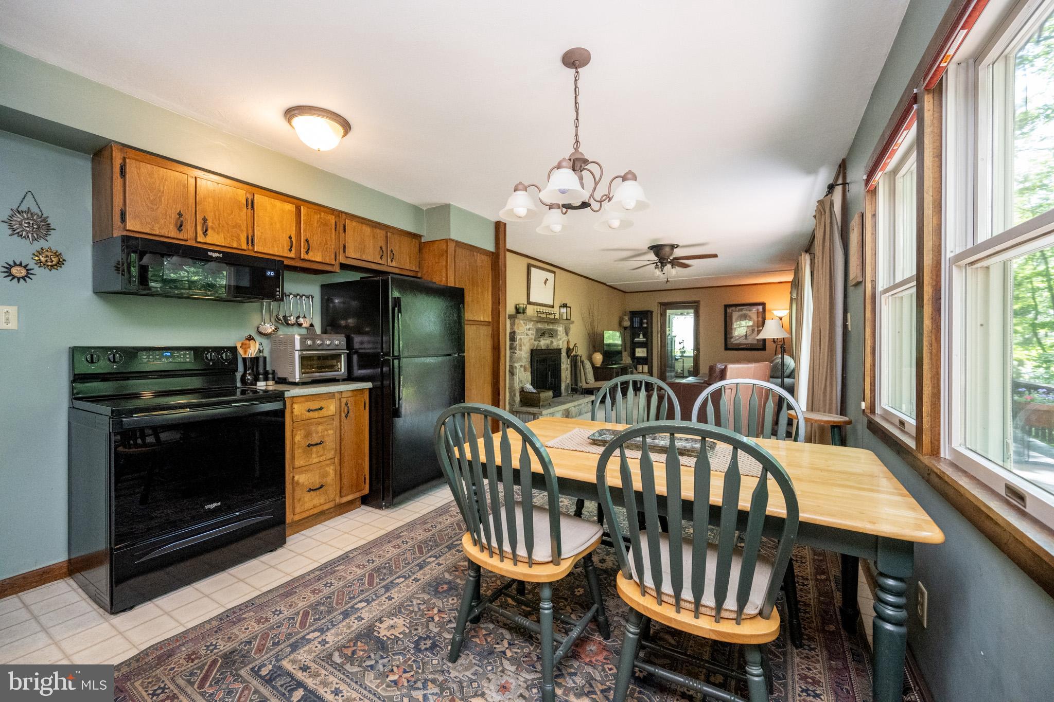 346 Skippers Point Road Oakland, MD 21550 - Photo 11 of 73 a view of a dining room with furniture a chandelier and wooden floor