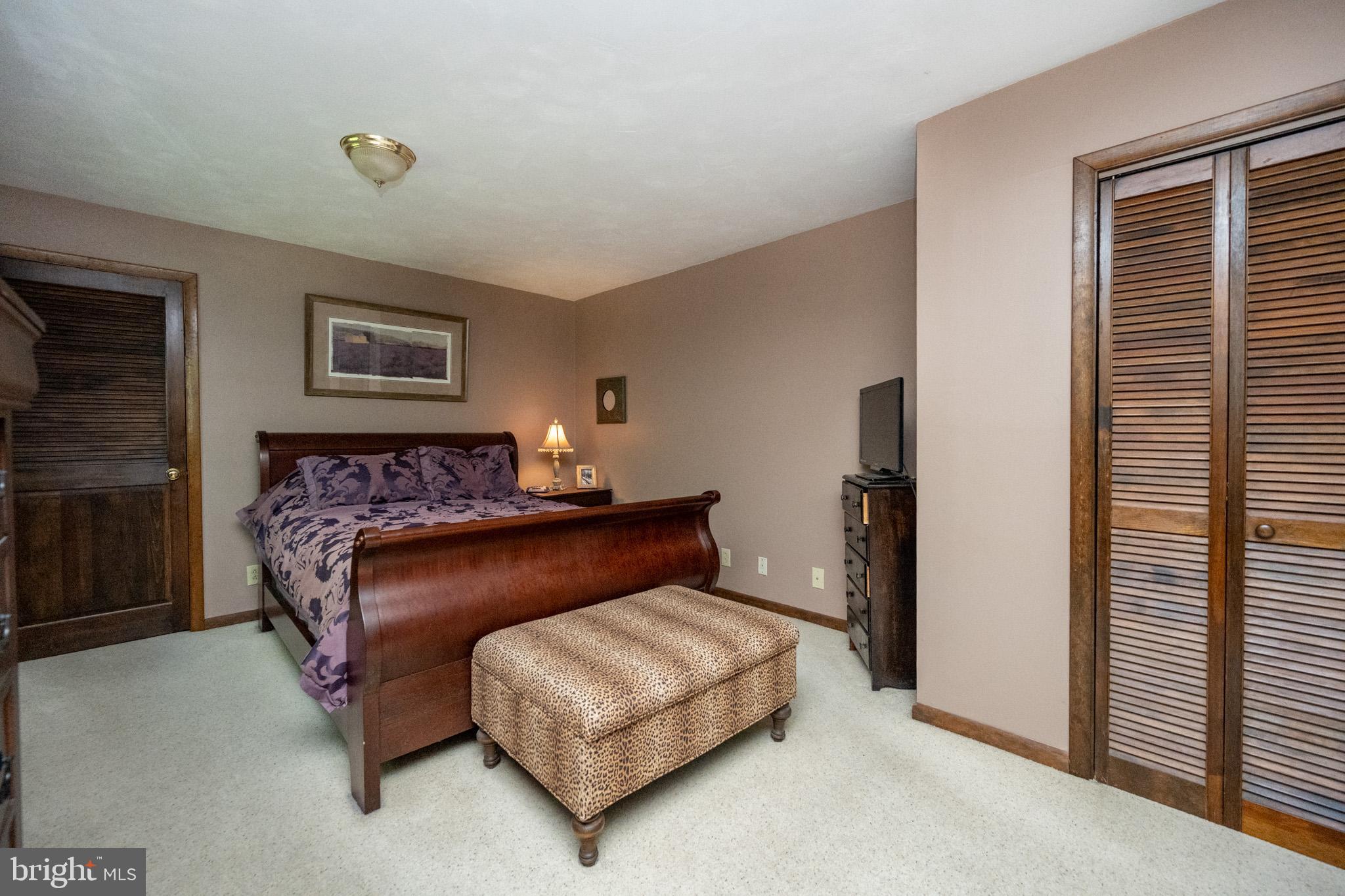 346 Skippers Point Road Oakland, MD 21550 - Photo 23 of 73 a bedroom with a bed rug and a window