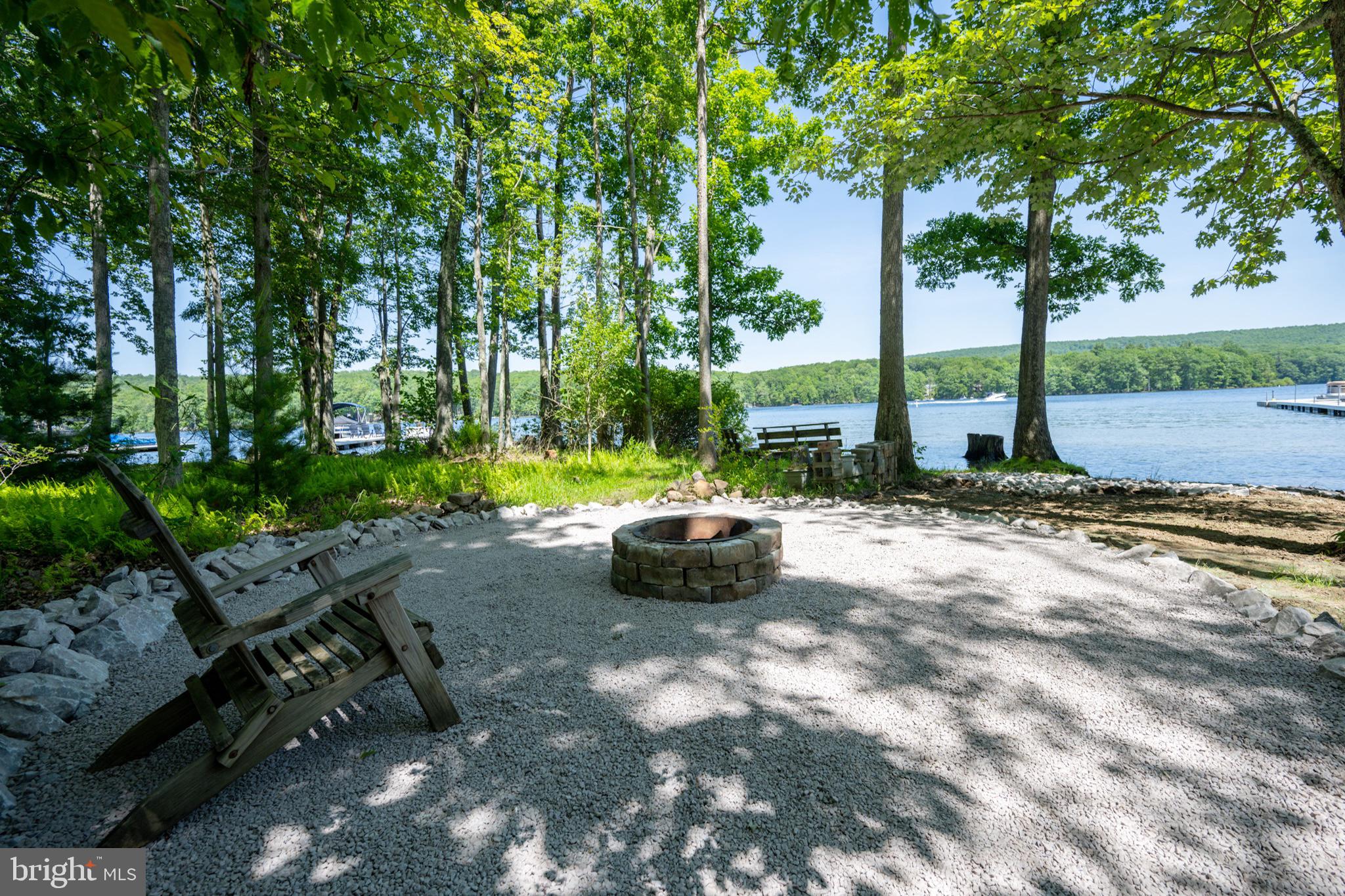 346 Skippers Point Road Oakland, MD 21550 - Photo 5 of 73 a view of a backyard with table and chairs plants and large trees