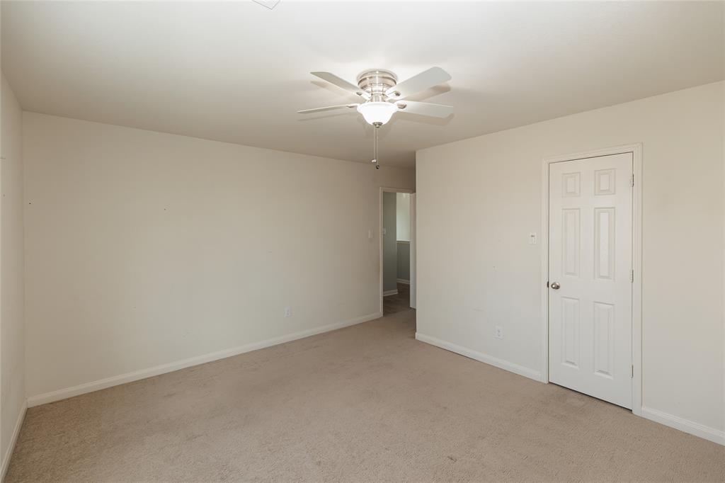 12637 Forest Lawn Road Rhome, TX 76078 - Photo 21 of 31 an empty room with a chandelier fan