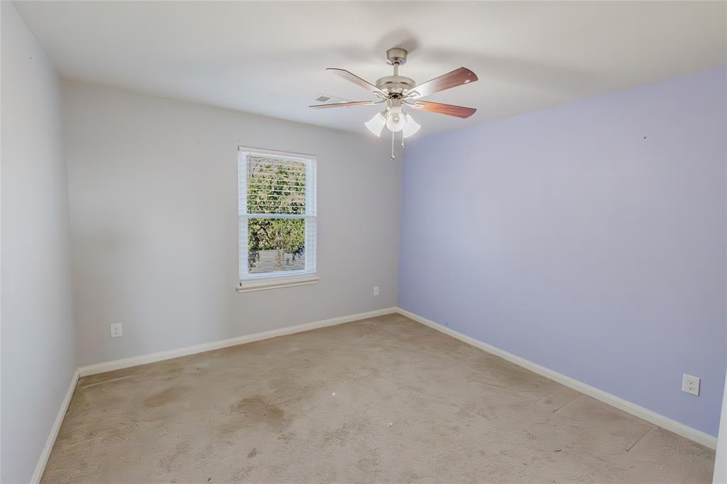 12637 Forest Lawn Road Rhome, TX 76078 - Photo 22 of 31 an empty room with windows and fan
