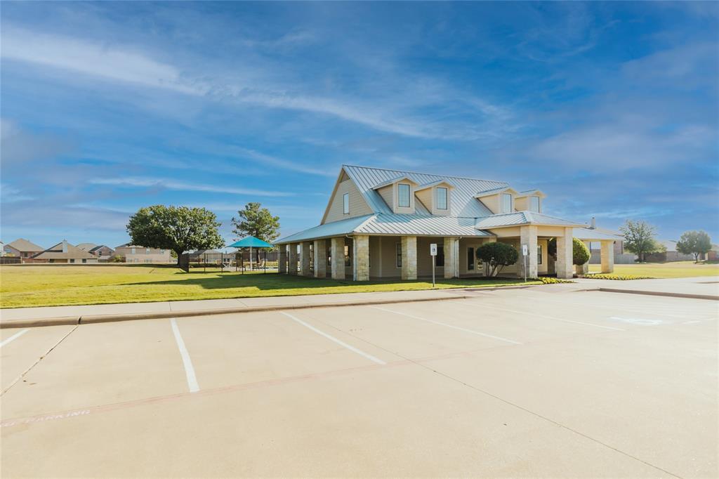 12637 Forest Lawn Road Rhome, TX 76078 - Photo 29 of 31 a front view of a house with swimming pool