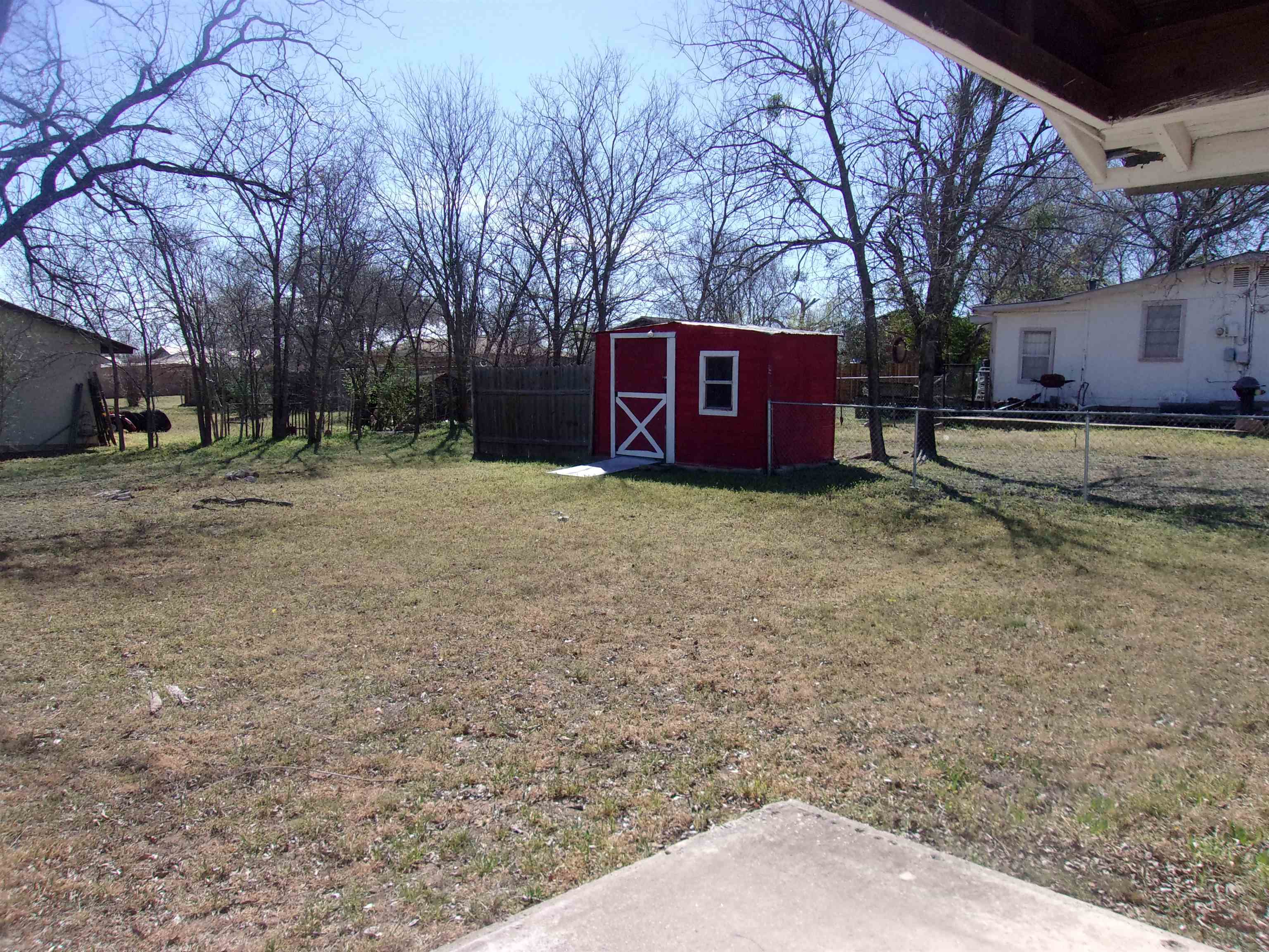 900 East Wallace Street Llano, TX 78643 - Photo 14 of 16 a view of a yard with large trees