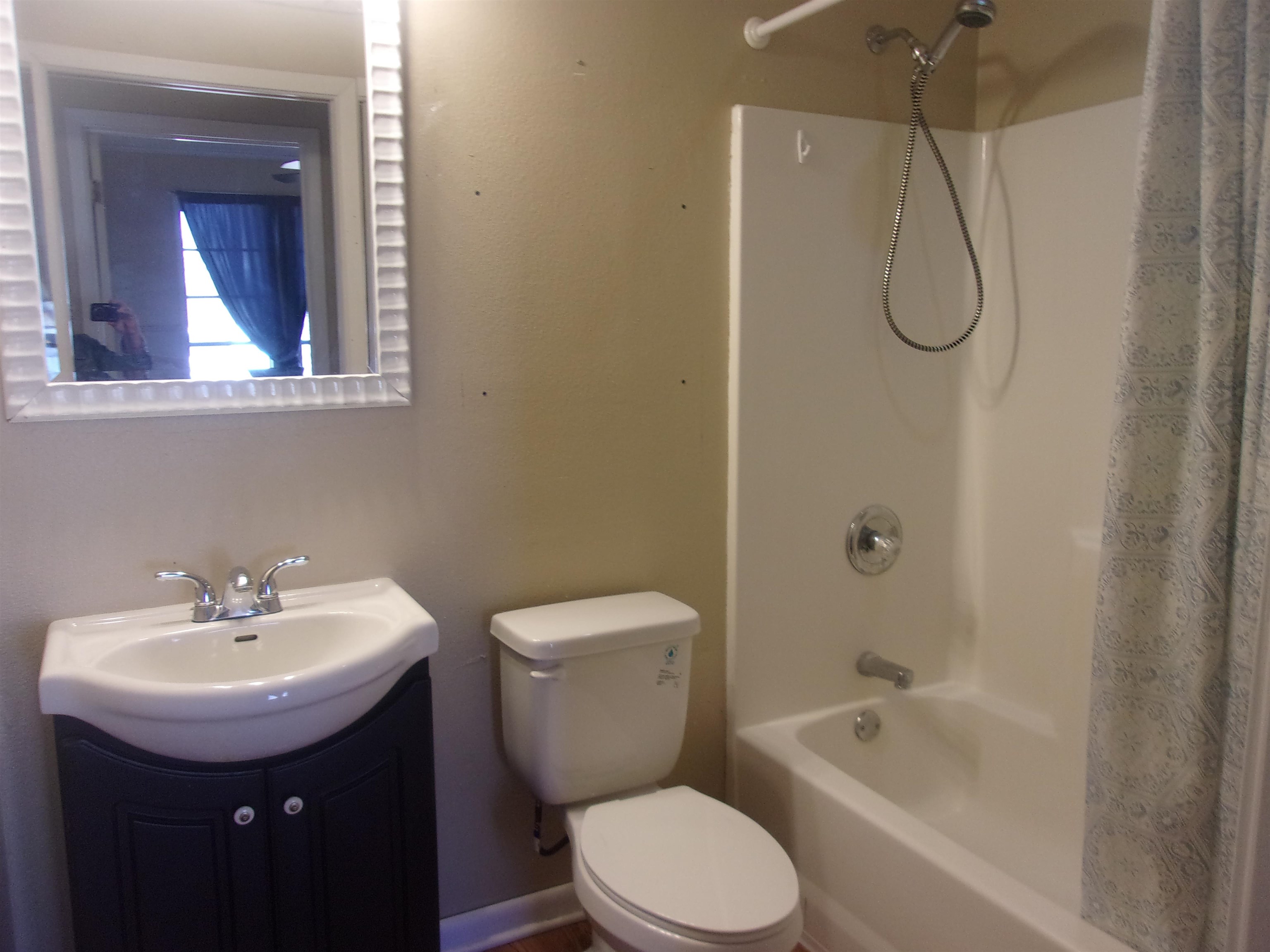 900 East Wallace Street Llano, TX 78643 - Photo 8 of 16 a bathroom with a sink toilet and shower