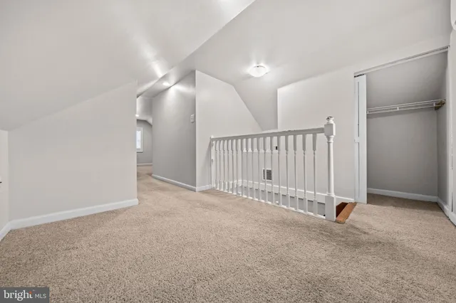 a view of a livingroom with a ceiling fan and entryway