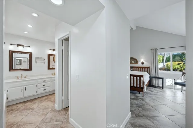 a view of kitchen with dining area and windows