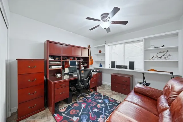 a living room with furniture and view of kitchen