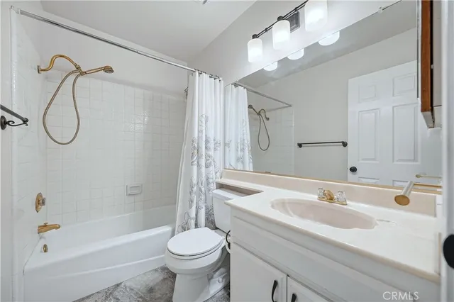 a bathroom with a sink a toilet and a bathtub