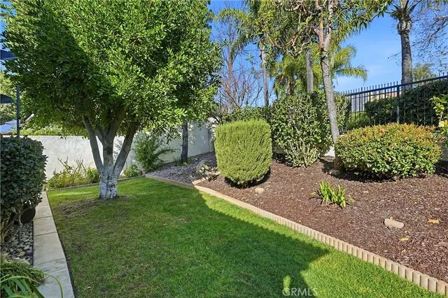 a green field with lots of trees