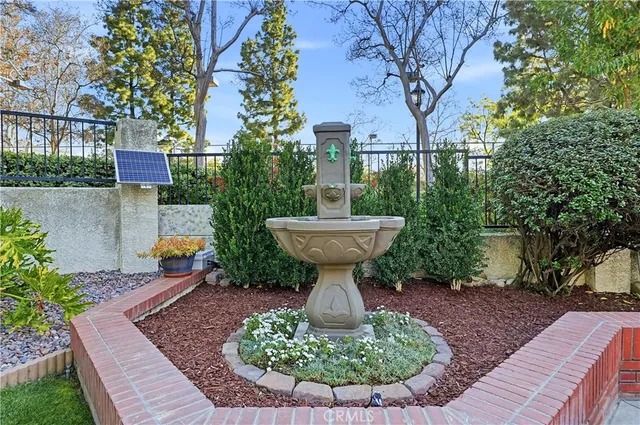 a view of a fountain in the yard