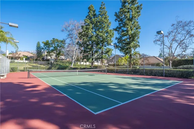 a swimming pool with outdoor seating and yard