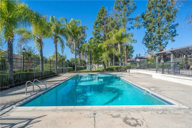 a view of swimming pool with a table and chairs