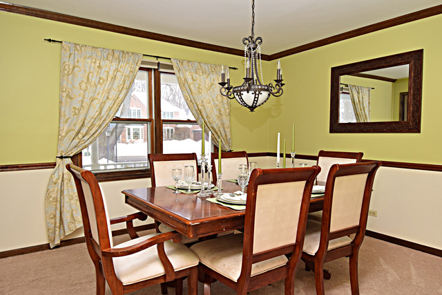 N040 Pierce Avenue Wheaton, IL 60187 - Photo 4 of 20 a view of a dining room with furniture window and wooden floor