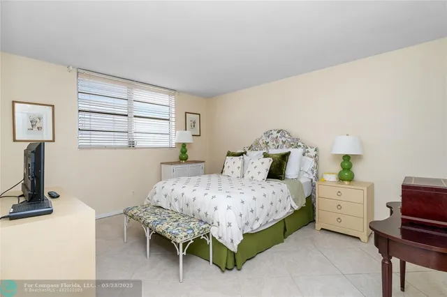 a bedroom with a bed and a table in it