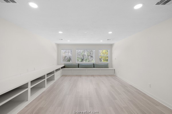 12 Raven's Nest Bryan, TX 77808 - Photo 22 of 46 a view of an empty room with wooden floor and a window