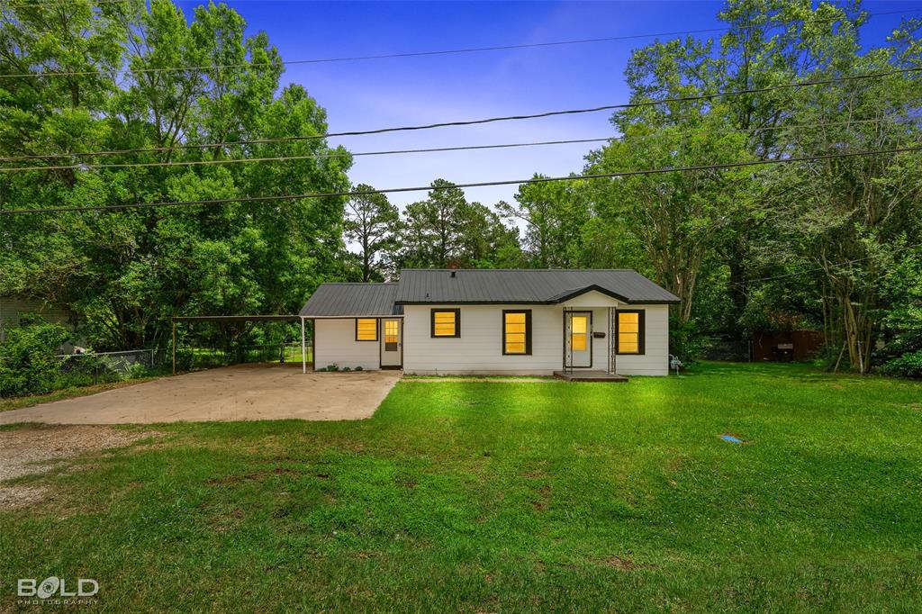 115 Pam Street Mansfield, LA 71052 - Photo 1 of 25 a front view of a house with yard and green space