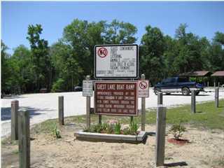Tba Dove Run Road Holt, FL 32564 - Photo 3 of 6 a view of outdoor space with sign board
