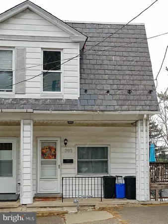 a front view of a house with garage