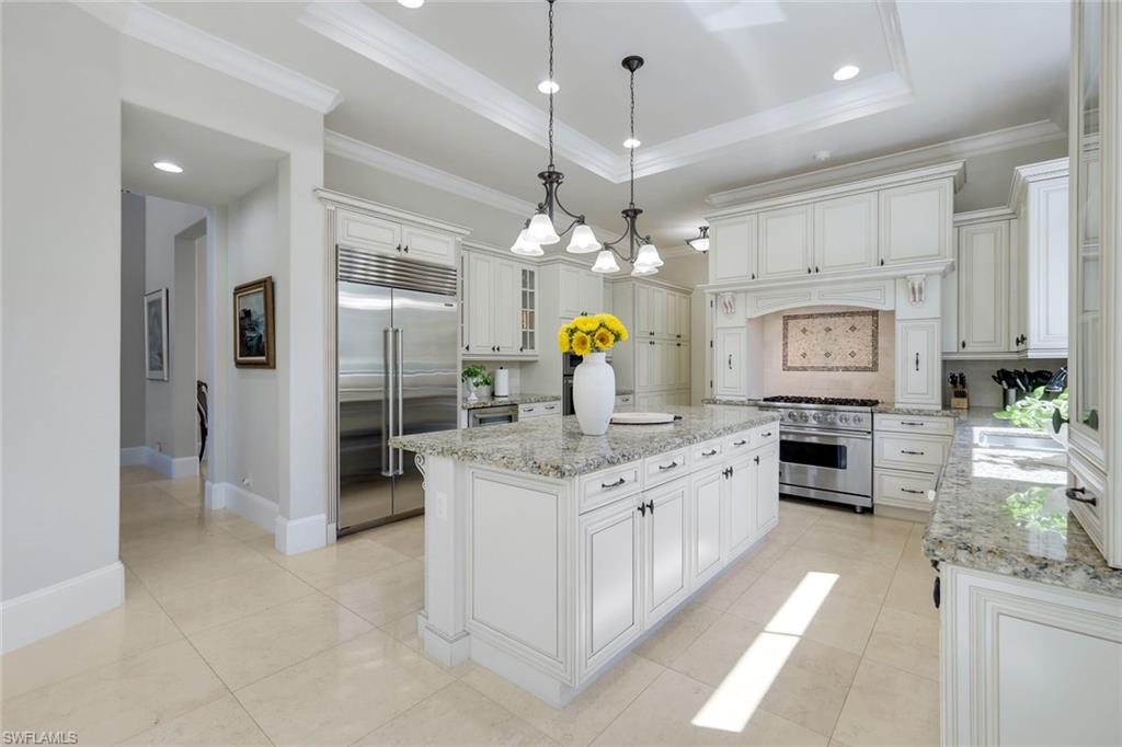 2351 Traditions Court Naples, FL 34105 - Photo 15 of 48 a large kitchen with stainless steel appliances granite countertop a stove oven and a refrigerator