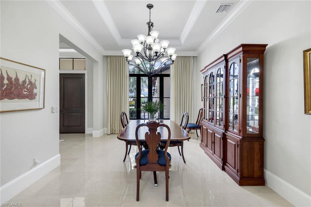 2351 Traditions Court Naples, FL 34105 - Photo 20 of 48 a view of a dining room with furniture window and outside view
