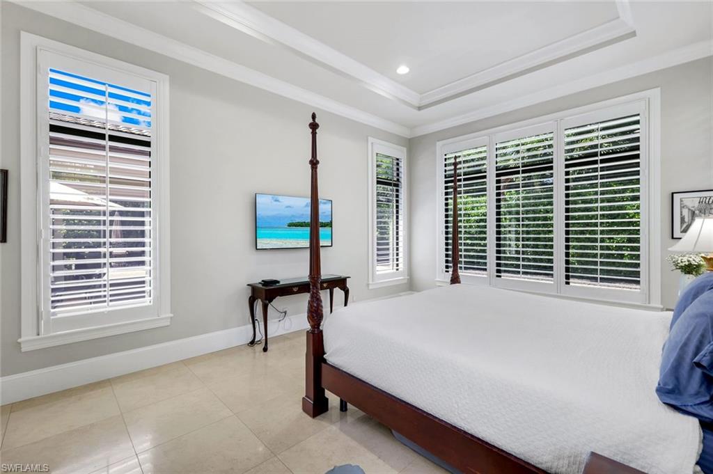 2351 Traditions Court Naples, FL 34105 - Photo 25 of 48 a bedroom with a bed chair and next to a window