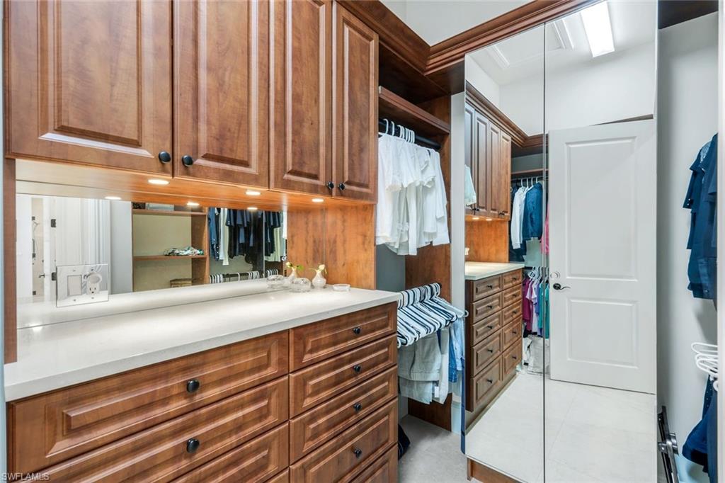 2351 Traditions Court Naples, FL 34105 - Photo 26 of 48 a kitchen with a sink and cabinets
