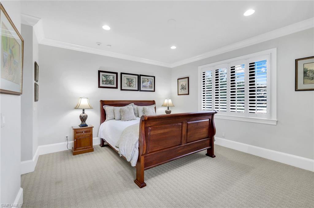 2351 Traditions Court Naples, FL 34105 - Photo 29 of 48 a bedroom with a bed and a window