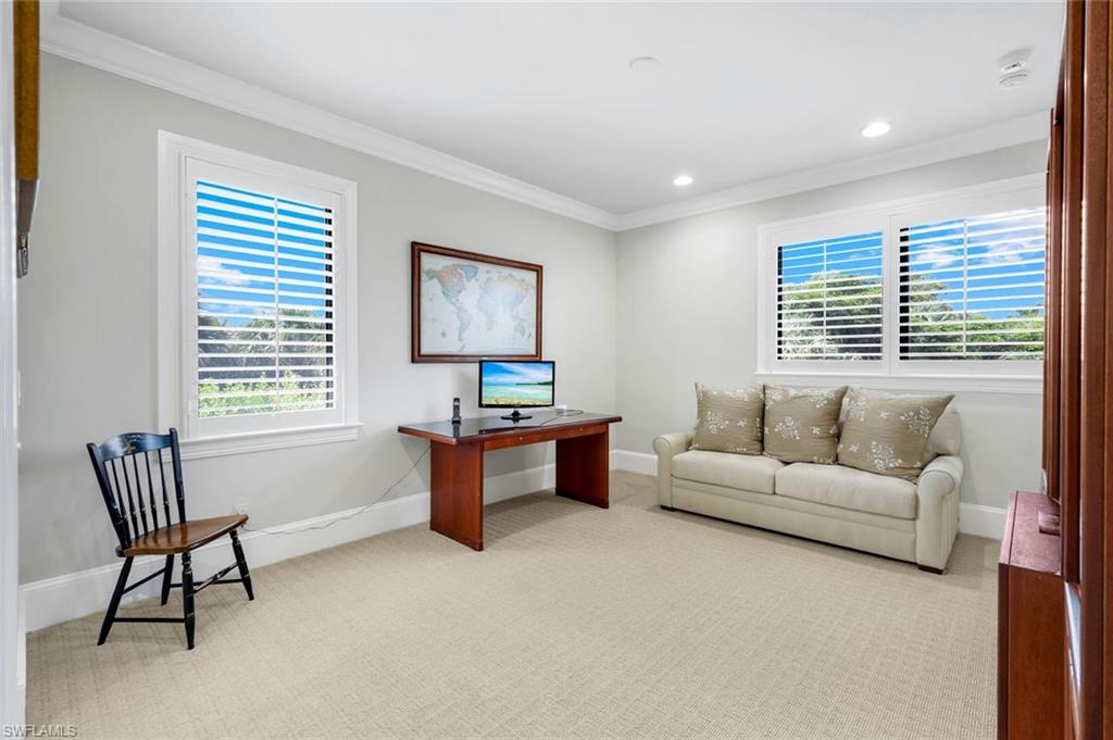 2351 Traditions Court Naples, FL 34105 - Photo 33 of 48 a living room with furniture and a window