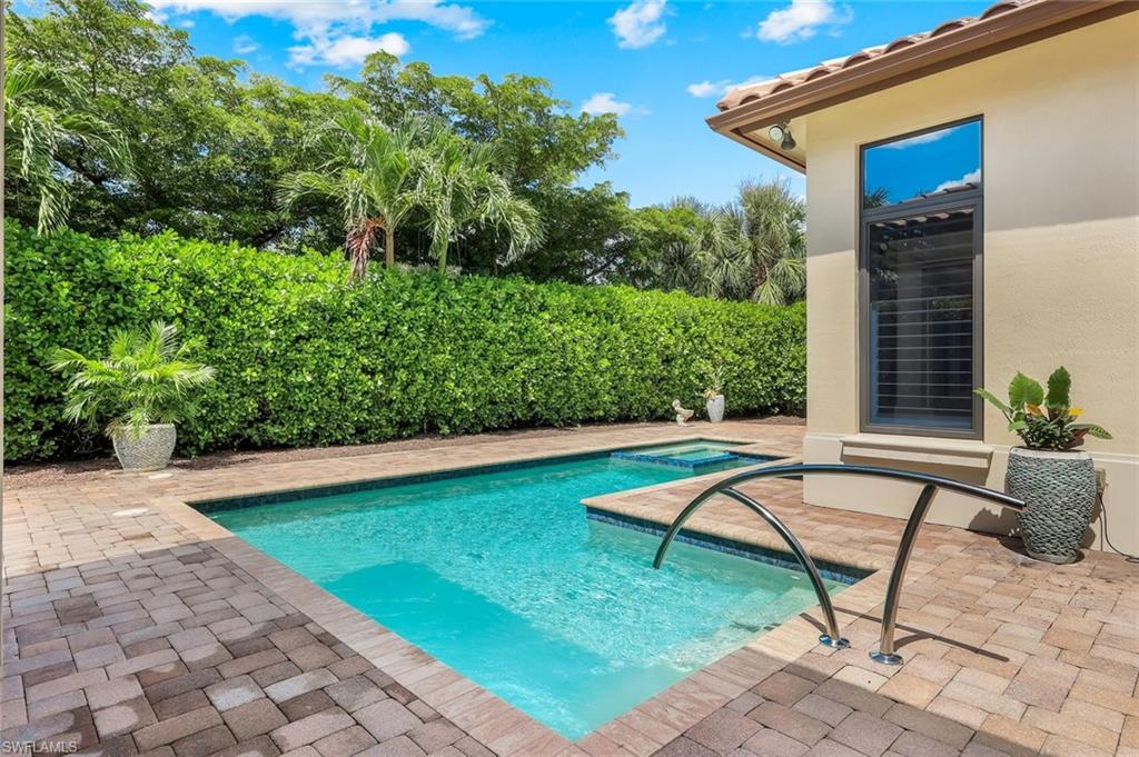 2351 Traditions Court Naples, FL 34105 - Photo 41 of 48 a backyard of a house with seating space