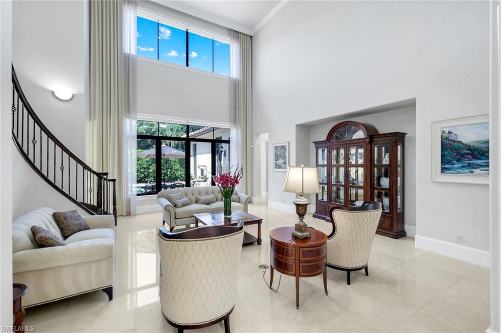 2351 Traditions Court Naples, FL 34105 - Photo 6 of 48 a living room with furniture and a potted plant