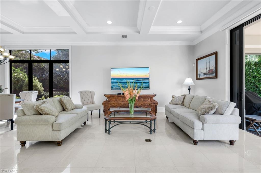 2351 Traditions Court Naples, FL 34105 - Photo 7 of 48 a living room with furniture and a large window