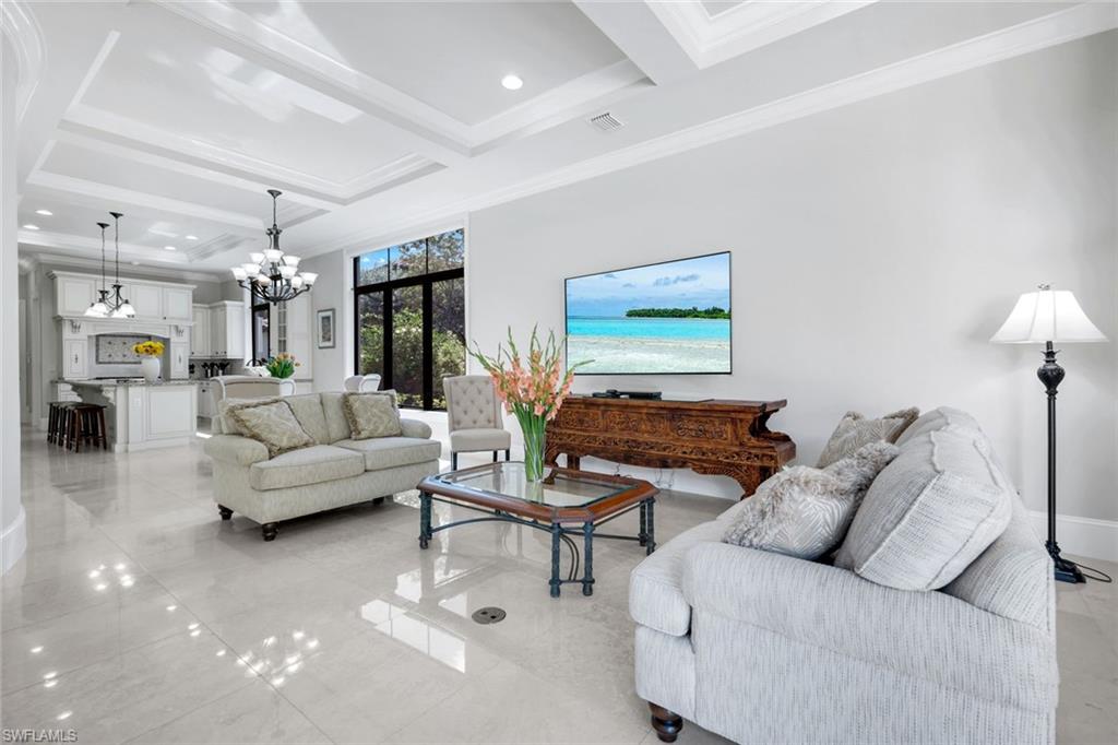 2351 Traditions Court Naples, FL 34105 - Photo 9 of 48 a living room with furniture and wooden floor