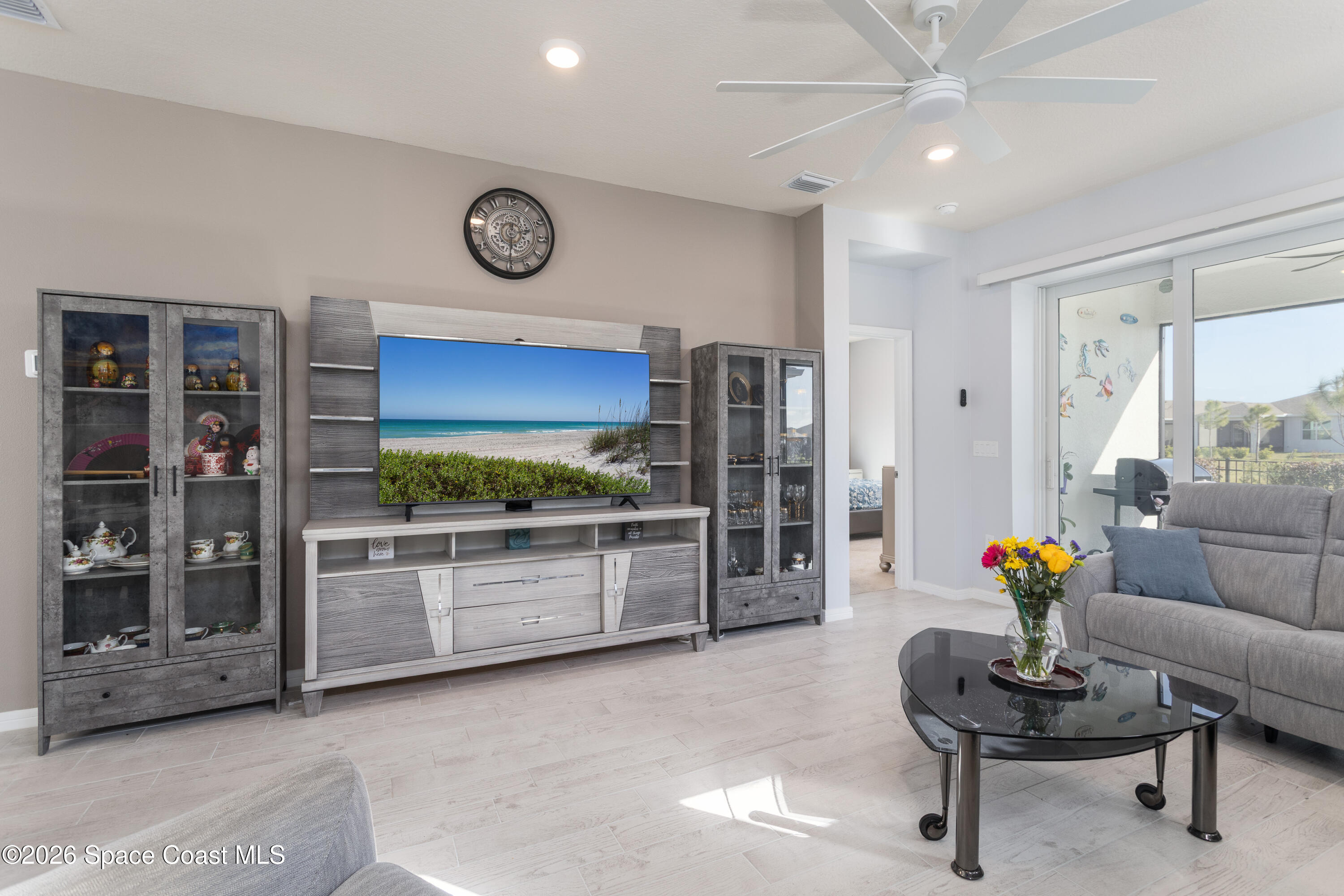 2993 Tidepool Place Melbourne, FL 32940 - Photo 14 of 50 a living room with furniture and a flat screen tv