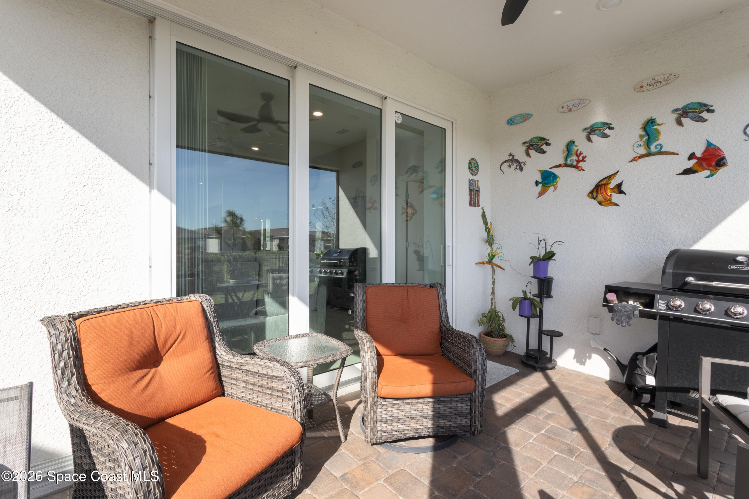 2993 Tidepool Place Melbourne, FL 32940 - Photo 17 of 50 a living room with furniture and wooden floor