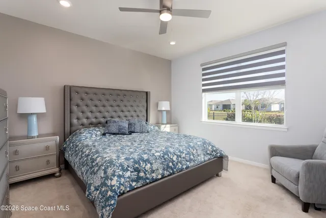 a bedroom with a bed and a couch