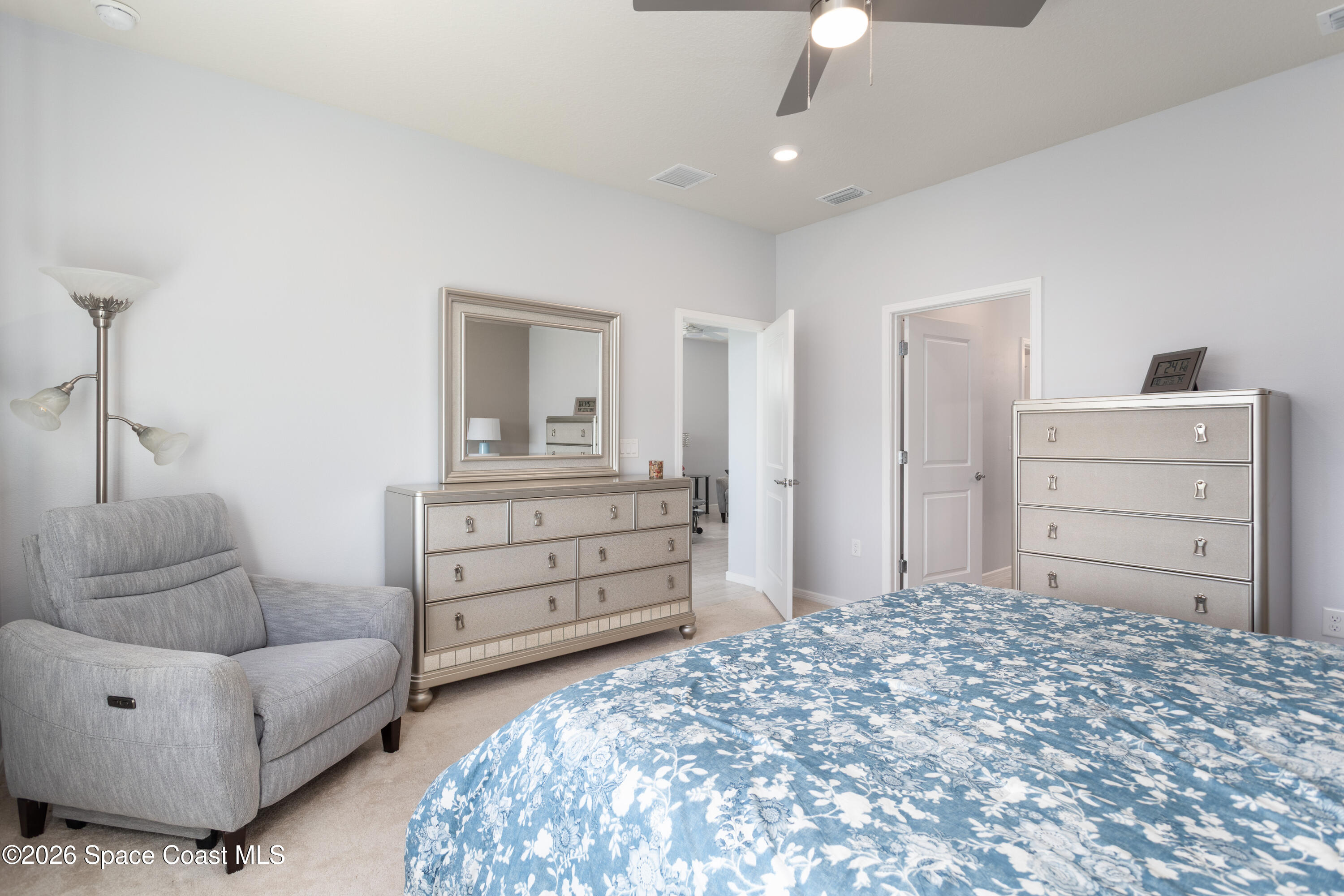 2993 Tidepool Place Melbourne, FL 32940 - Photo 19 of 50 a bedroom with a bed and furniture