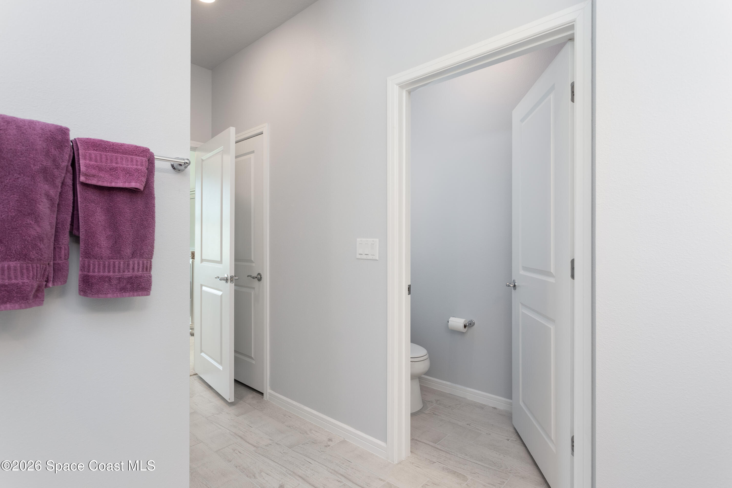 2993 Tidepool Place Melbourne, FL 32940 - Photo 21 of 50 a view of a hallway with closet and a room