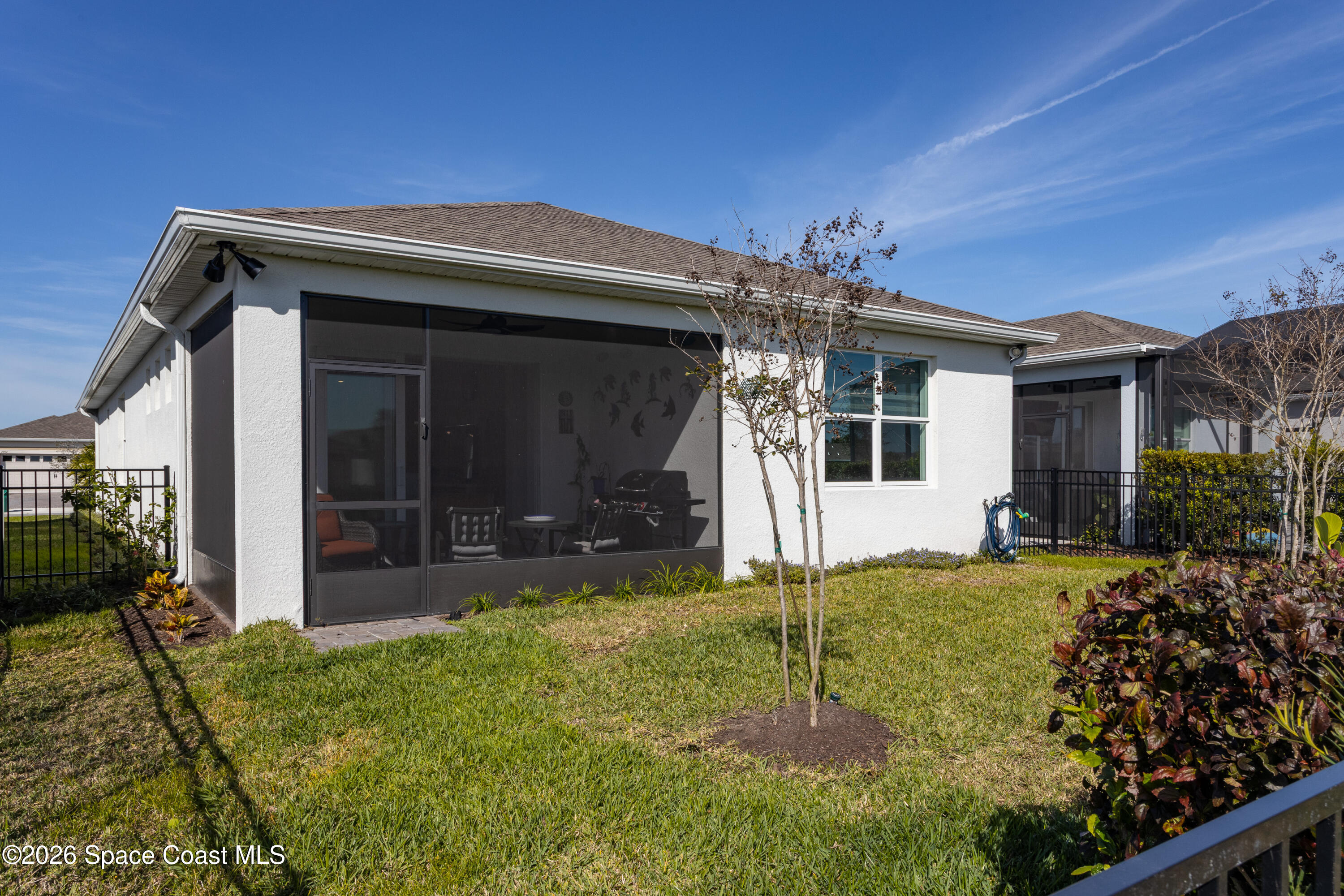 2993 Tidepool Place Melbourne, FL 32940 - Photo 27 of 50 a view of a house with backyard and porch
