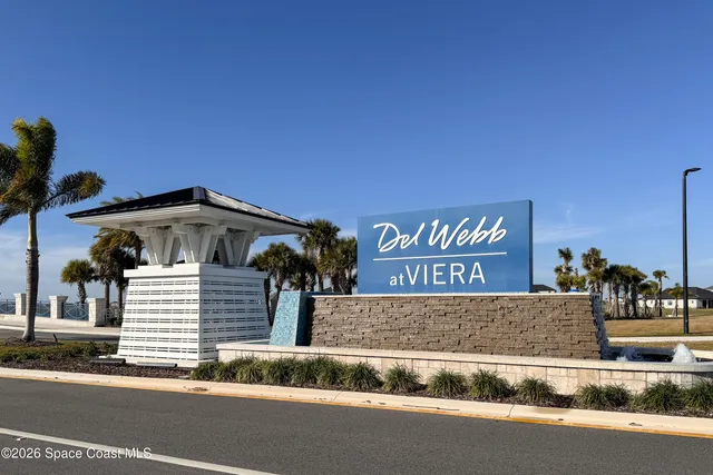 a view of the house with a swimming pool